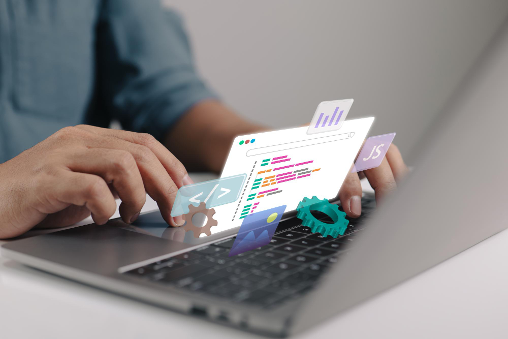 A person using a laptop with icons on it, representing productivity and technology.