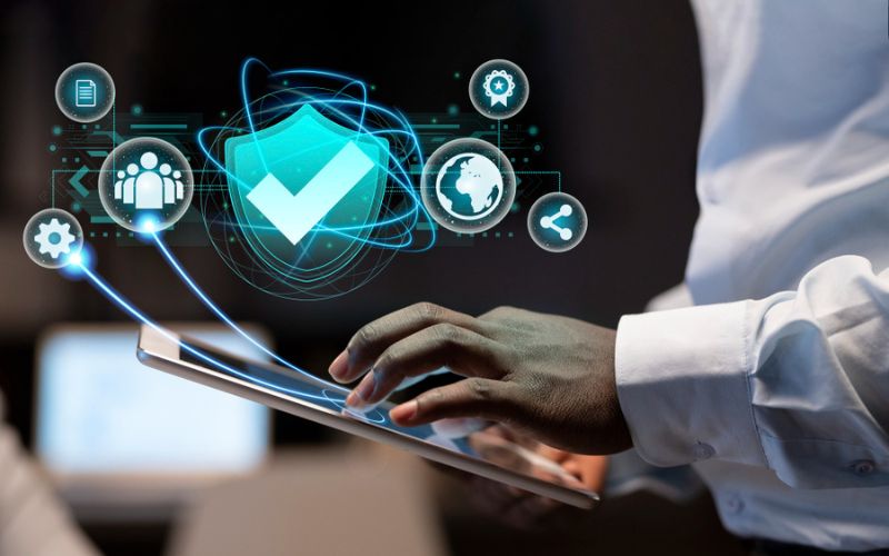 Visual representation of a shield and lock, indicating security measures to defend businesses from cyber attacks.